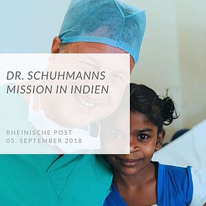 Dr. Schuhmann mit indischem Mädchen
